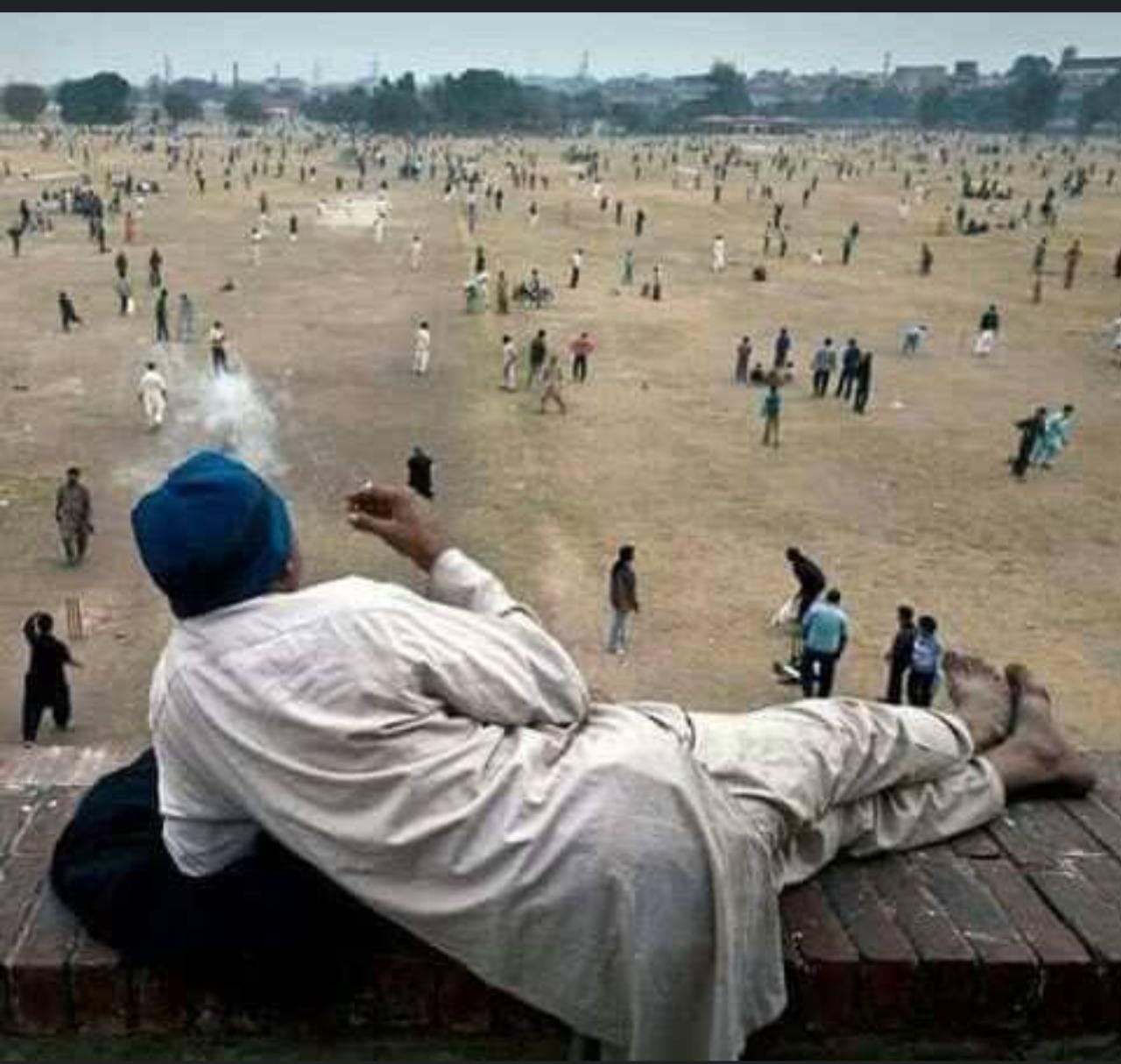 Indian Man Watches Battle While Smoking meme template variation