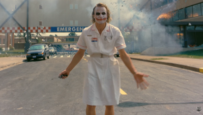 Joker blowing up hospital meme template from The Dark Knight