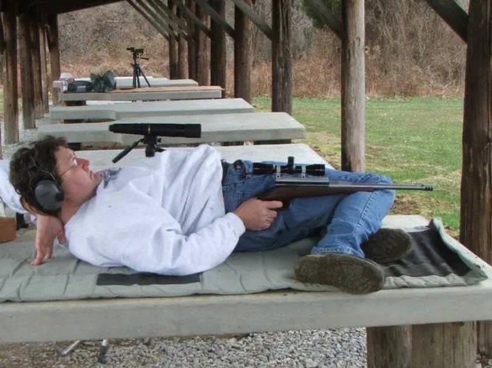 Man Shooting Gun At Range With Weird Pose meme template