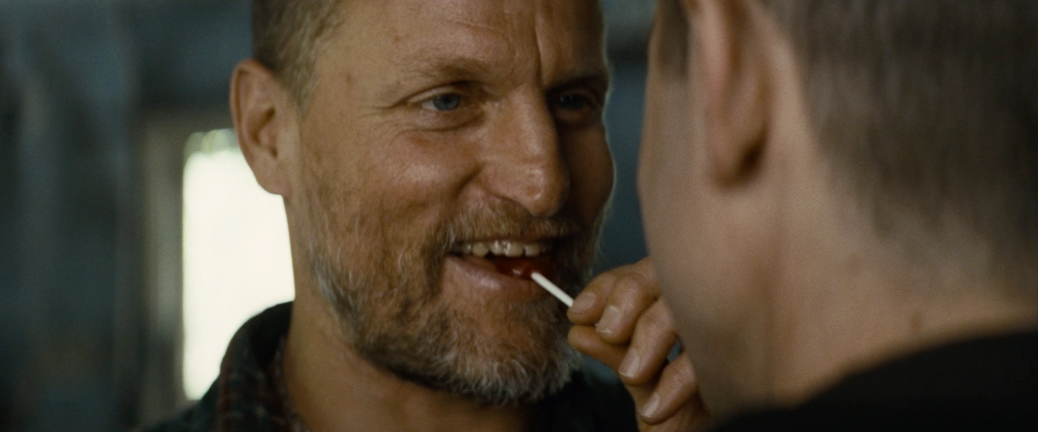 Smiling Woody Harrelson with Lollipop - Out of the Furnace meme template variation