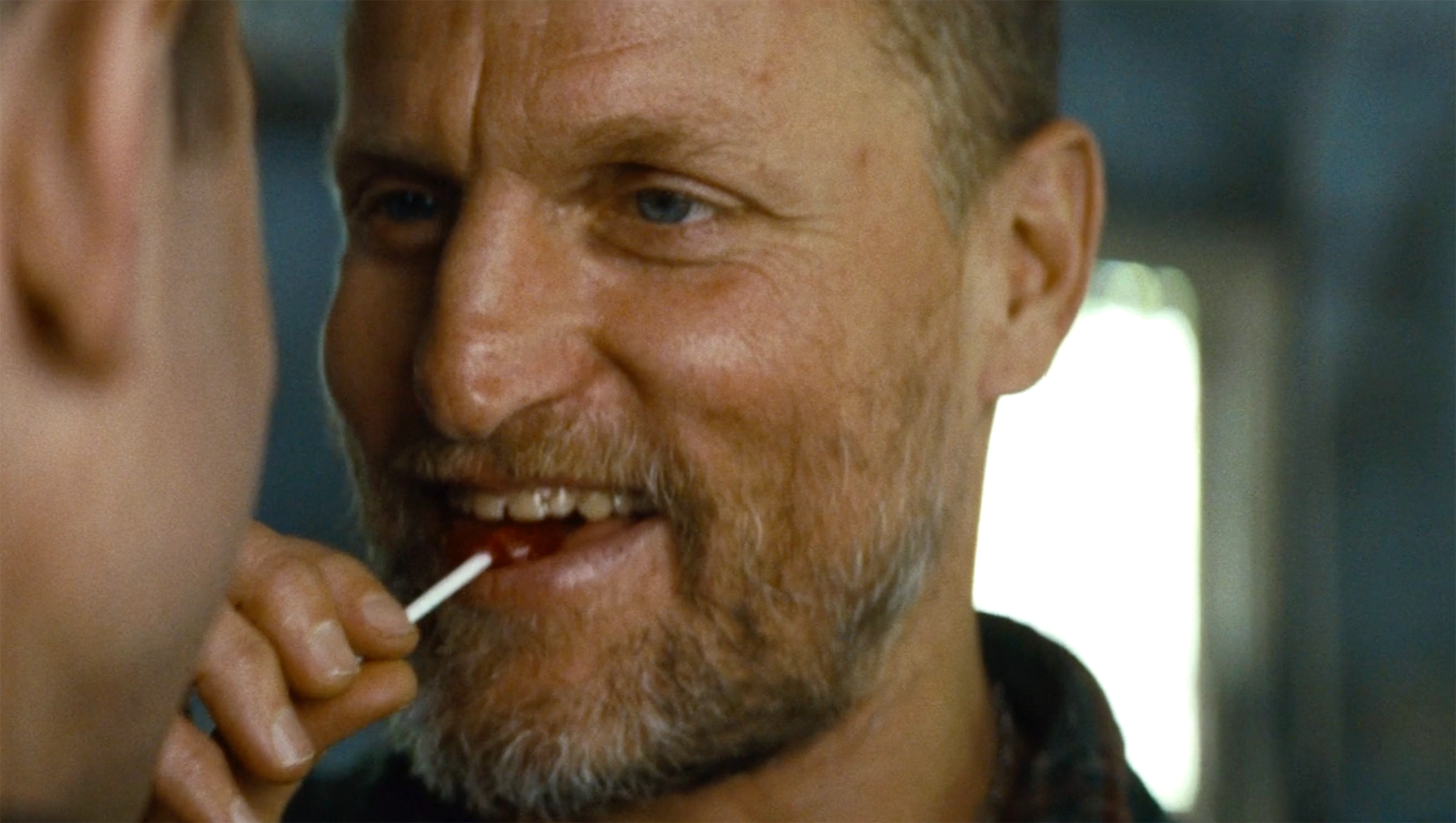 Smiling Woody Harrelson with Lollipop - Out of the Furnace