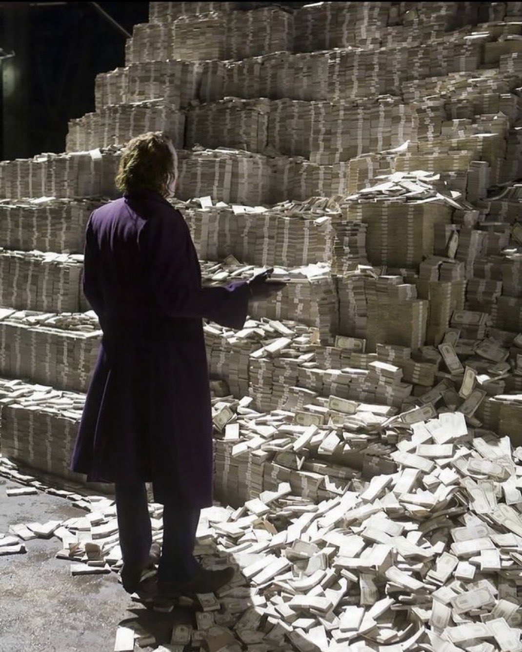 The Joker Staring At Large Pile of Money - The Dark Knight meme template