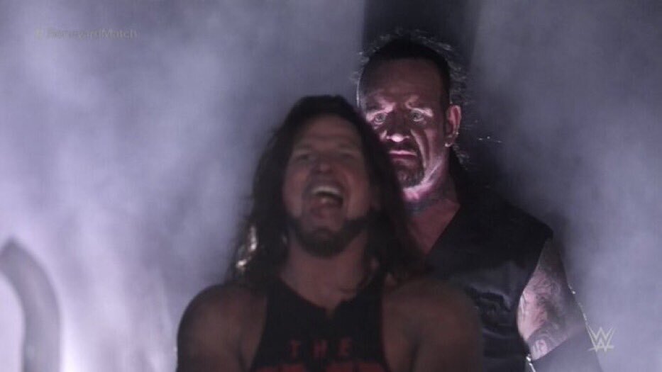 Undertaker Standing Behind AJ Styles Menacingly meme template
