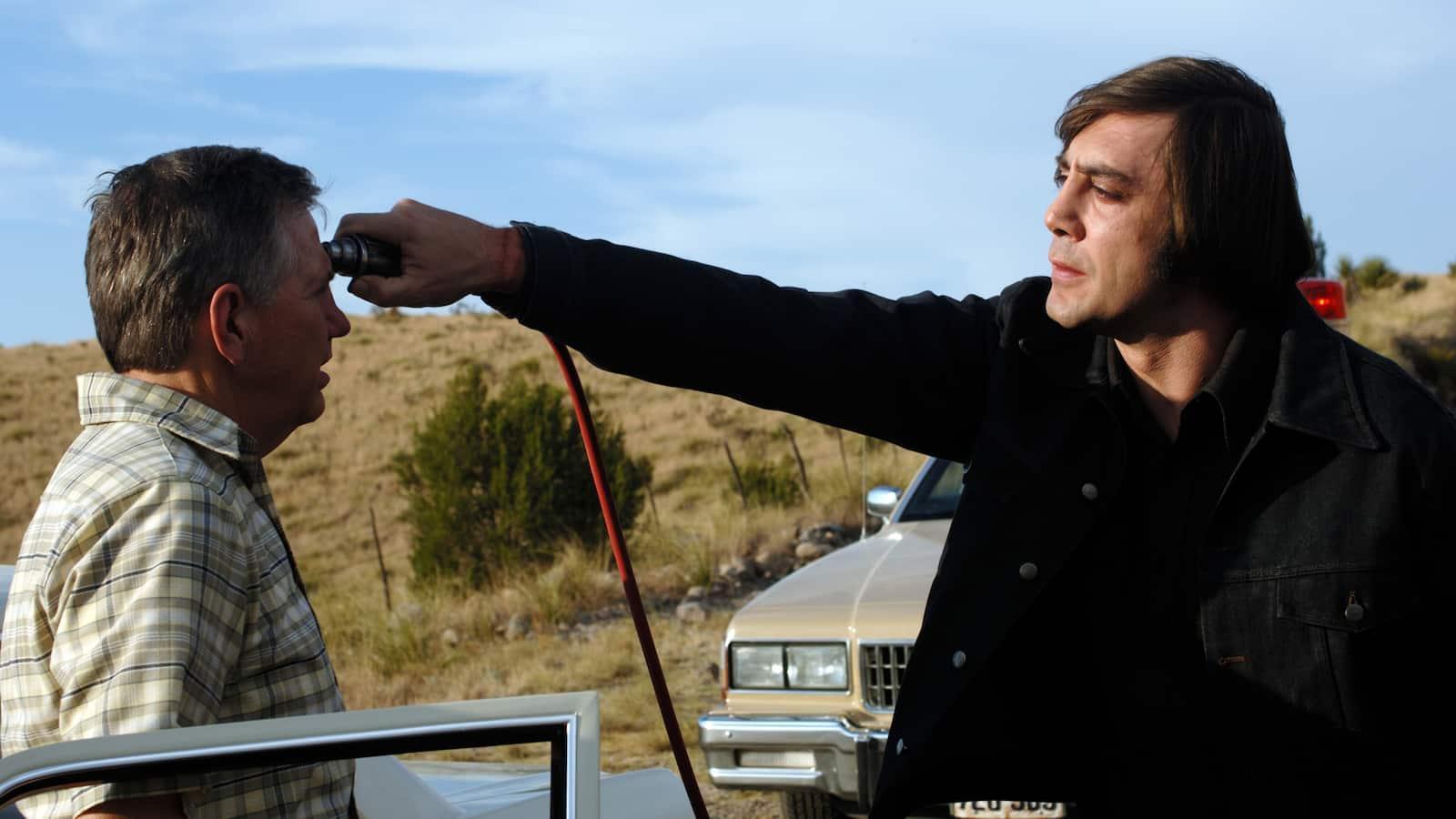 Anton Chigurh Holding Cattle Gun To Guy's Head - No Country for Old Men meme template
