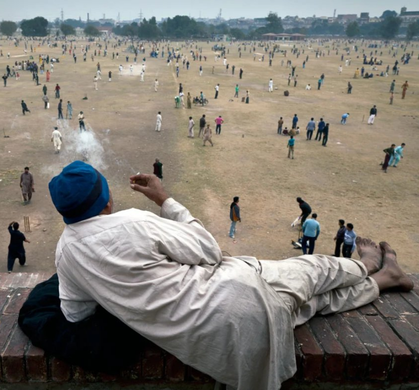 Indian Man Watches Battle While Smoking meme template