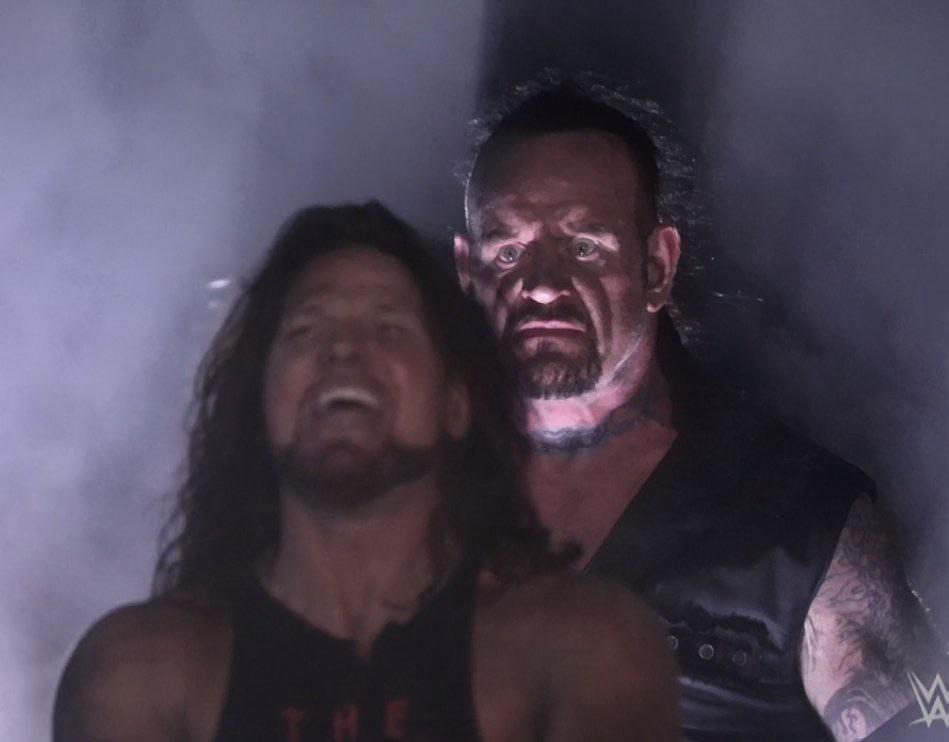 Undertaker Standing Behind AJ Styles Menacingly meme template